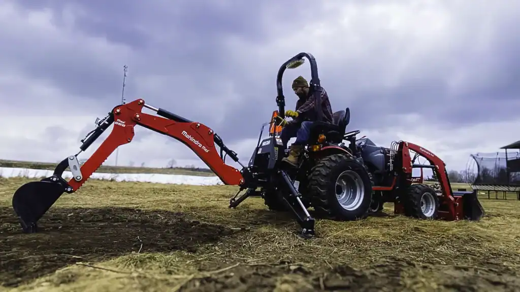 Using a tractor to overturn a garden in Norwood, Ontario